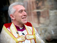 Archbishop volunteers for Big Help Out by cleaning Gwynedd beach