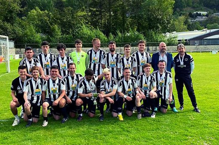 Bow Street Reserves were handed the FAW Reserves Central title trophy after the game at Dolgellau