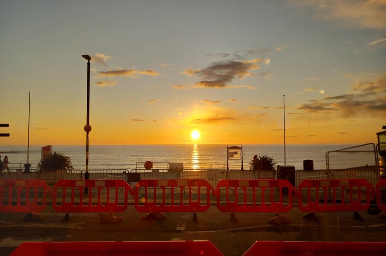 This picture of last night's sunset also shows the streetlighting works taking place in Aberystwyth