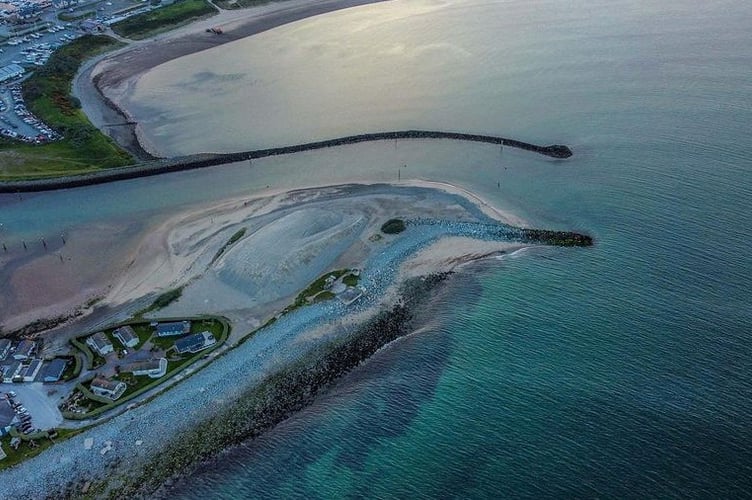 This drone photo reveals a harbour that looks like - a dolphin. Photographer Rhys Jones was amazed to see the likeness in an aerial picture he took over Pwllheli in Wales.See SWNS story SWLNdolphin. Rhys has taken his drone over the marina many times but this was the first time he noticed the aquatic appearance of the landscape. The 37-year-old, who has been taking drone photos as a hobby for the past two years, said: "Once seen it it cannot be unseen. "In all my flight time over over the Pwllheli harbour I have never noticed this as much as last night, spectacular!"