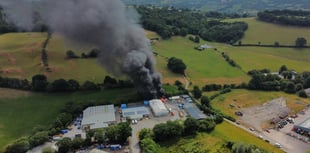 Drone footage shows fire at body repair business