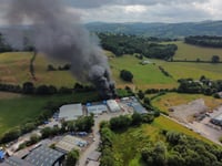 Drone footage shows fire at body repair business
