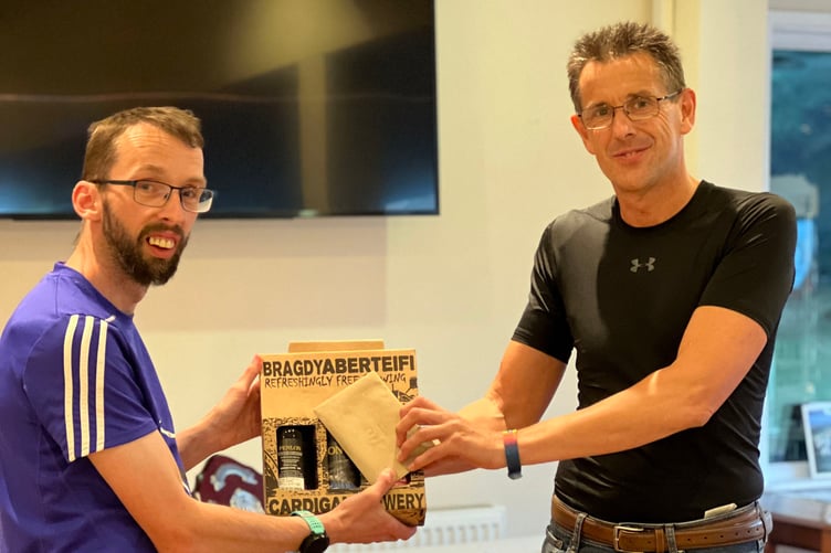 Outgoing chair Ian Evans receiving his award from new chair Paul Williams Aberystwyth Athletics Club 2023