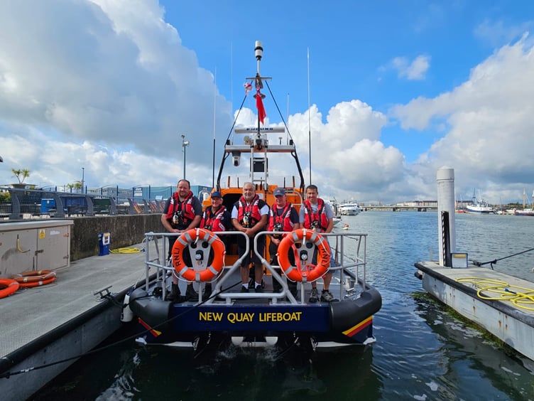 The crew, ready for the passage to bring the new lifeboat home to New Quay