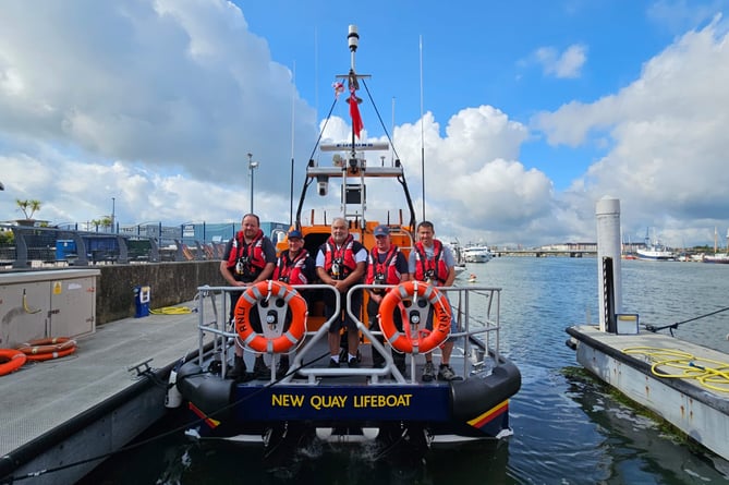 The crew, ready for the passage to bring the new lifeboat home to New Quay