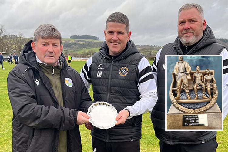 Bow Street's Llyr Hughes (centre) has been named Ardal Northern East manager of the season. He is pictured receiving the manager of the month award for December