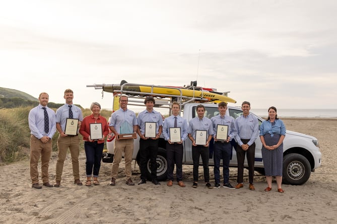 Newgale RNLI lifeguards and Ceredigion lifeguards are congratulated on receiving their Alison Saunders awards by Lifeguard Leads Pete Rooney and Jo Price