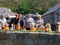 Helpers of all ages plant flowers to keep Barmouth looking beautiful