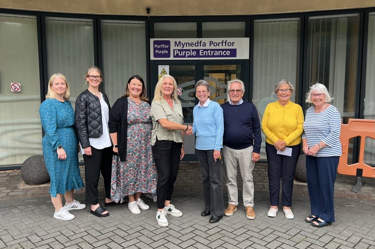 The past and present officers of the League of Friends of Bronglais Hospital met outside the building for an official handover