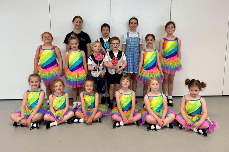 Dorothy and some of the youngsters playing the parts of the munchkins