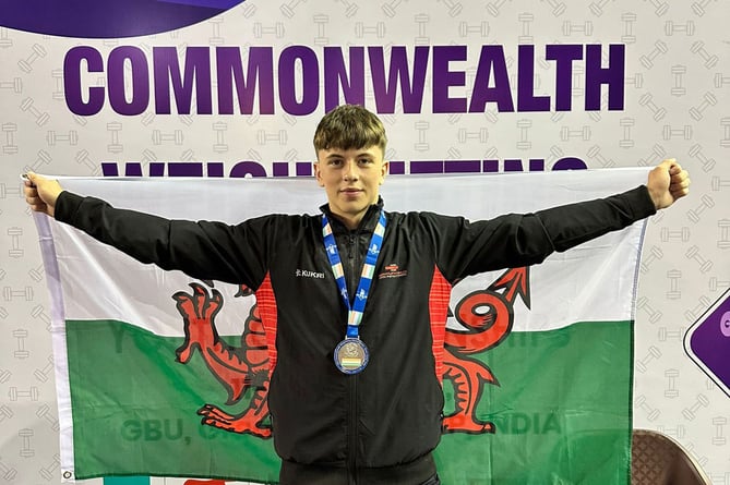 Reigning Welsh champion Cian Green celebrates after winning his silver medal at the Commonwealth weightlifting championships