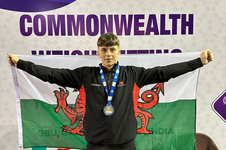 Reigning Welsh champion Cian Green celebrates after winning his silver medal at the Commonwealth weightlifting championships