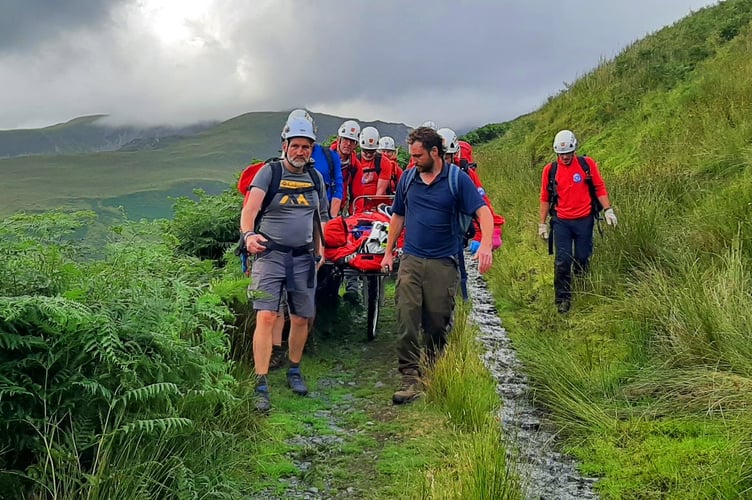 Aberdyfi Search & Rescue Team members extract the casualty on a stretcher