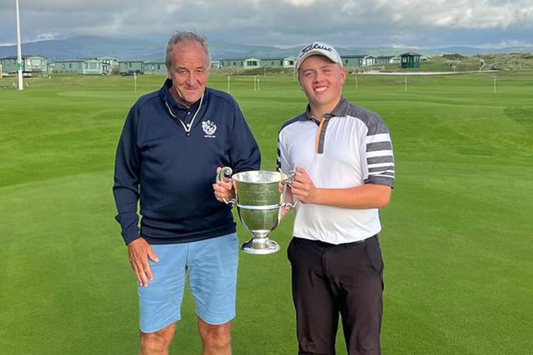 Logan Scherpe pictured with Aberdovey Golf Club captain Andrew Upson 2023