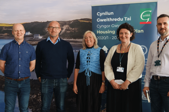 Gwynedd Council Chief Executive, Dafydd Gibbard; Cabinet Member for Housing and Property, Cllr Craig ab Iago; MP Liz Saville Roberts; Head of Housing and Property Department Carys Fôn Williams and Gareth Moriarty Owens from the council’s Housing Department took part in the launch on Monday on the council’s stand at the National Eisteddfod
