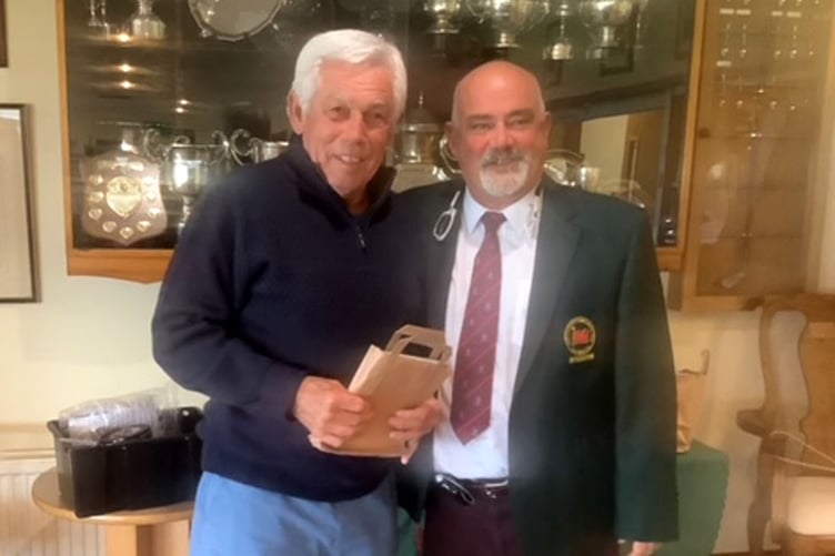 Derek Saunders being presented by Captain Dave Blesovsky