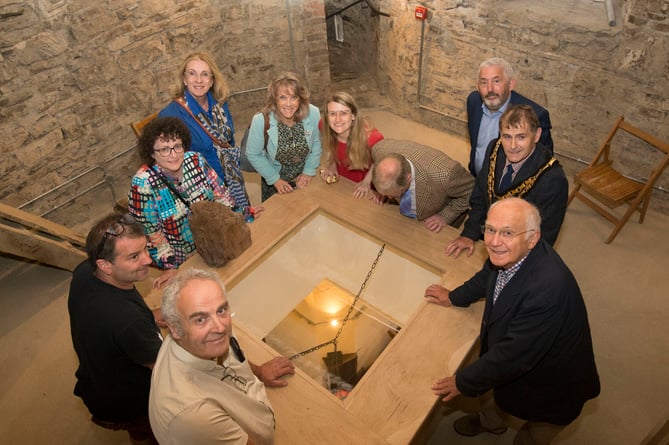 Taken on the 1st floor of the tower around a glazed viewing hatch looking down onto the ground floor of the church.  Clockwise from front left:  Carpenters Tim Dicker and Piers Lance, Elin Jones, Denise Lewis-Poulton NLHF, Tanya Frizwell (Pentir Pumlumon), Rachael Adams, National Churches Trust,) looking down Cllr Meirion Davies,  Cllr Maldwyn Lewis, Dafydd Wyn Morgan, (Cambrian Mountains Initiative,) Architect Frans Nicholas