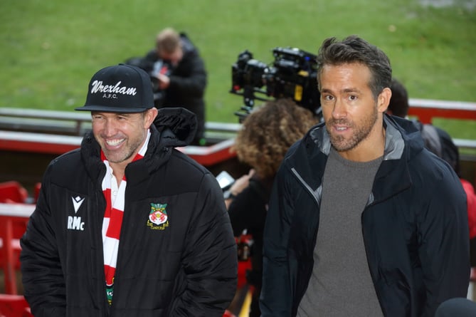Wrexham A.F.C co-owners Ryan Reynolds and Rob McElhenny address the media at the Racecourse Ground. Wrexham