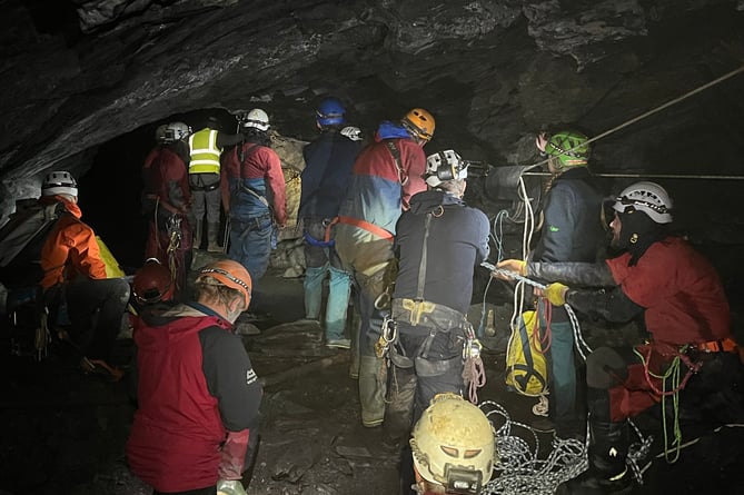 North Wales Cave Rescue Organisation members prepare to haul stranded person up the underground pitch