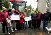 Tractor run organisers donate £750 to charities