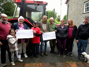 Tractor run organisers donate £750 to charities