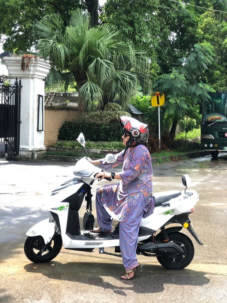 A student on one of the mopeds in Pakistan