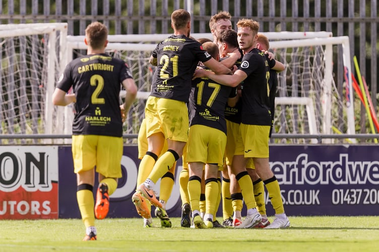 HAVERFORDWEST, WALES - 26 AUGUST 2023: Caernarfon Town's Louis Lloyd scores and celebrates making the game 0-1 during the 2023/24 JD Cymru Premier league fixture between Haverfordwest County A.F.C & Caernarfon Town FC, Bridge Meadow Stadium. (Pic by John Smith/FAW)