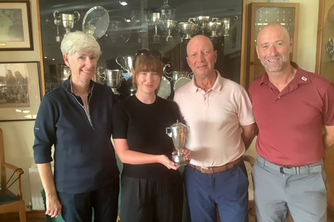 Rhian Raw Rees and Jeff Evans (middle) being presented with the Ashley Jones Cup  by vice captains Catrin Pugh Jones and Alan Shaw