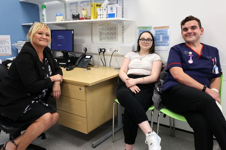 GP Dr Jodie Walker and ANP Dominic Marten with Jorja during her return visit to the practice to thank the staff who saved her