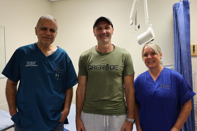 Paul Fletcher from Minffordd, near Porthmadog, with his surgeon Mr Anil Lala and Stoma Nurse Ann Hart at a follow up appointment at Ysbyty Gwynedd