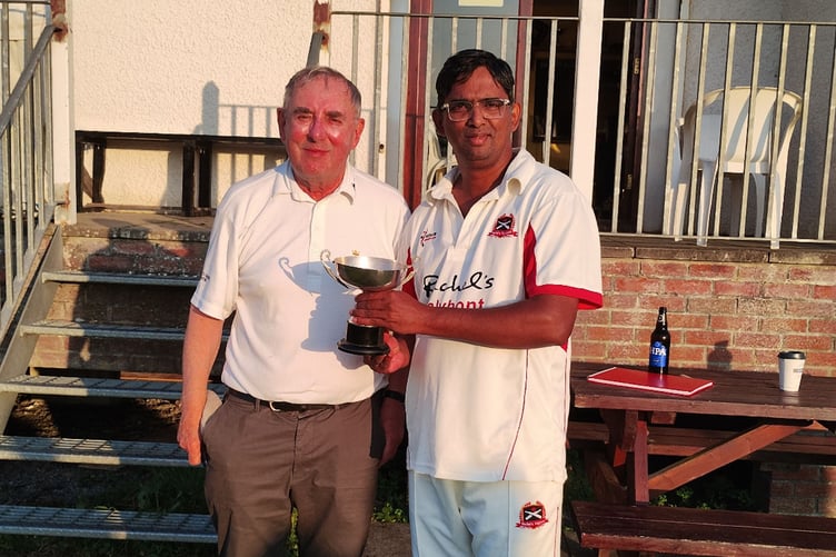 Robin Varley presents the trophy to Vinod Matthew