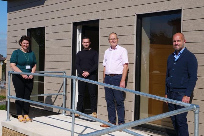 Gwynedd Council head of Housing and Property, Carys Fôn Williams; Gareth Moriarty Owens, of the council’s Housing and Property Department; Cllr Dyfrig Siencyn, council leader; Cabinet Member for Housing and Property, Cllr Craig ab Iago at one of the units in Caernarfon