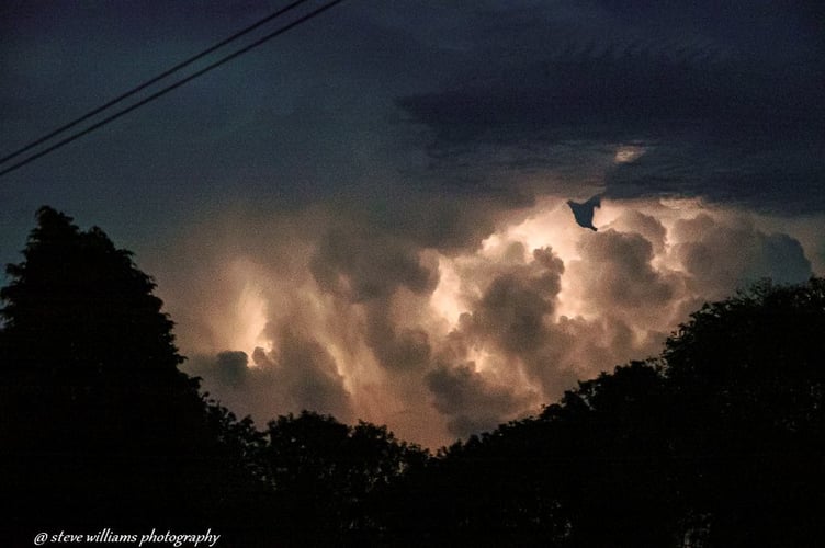 The lightning lit up the cloud