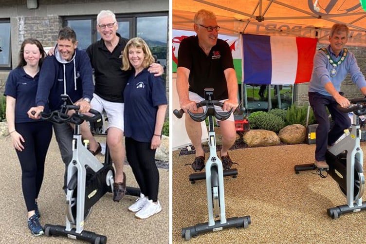 They’ve done it! Bala Lake Railway Trust chairman Julian Birley (second from right) thanks organisers of the 24 hour spin cycle Lois Jones, Mark Bennet and Mia Jones. Above right,  Julian Birley and Mayor of Bala Town Council Eifion Roberts produce some pedal power
