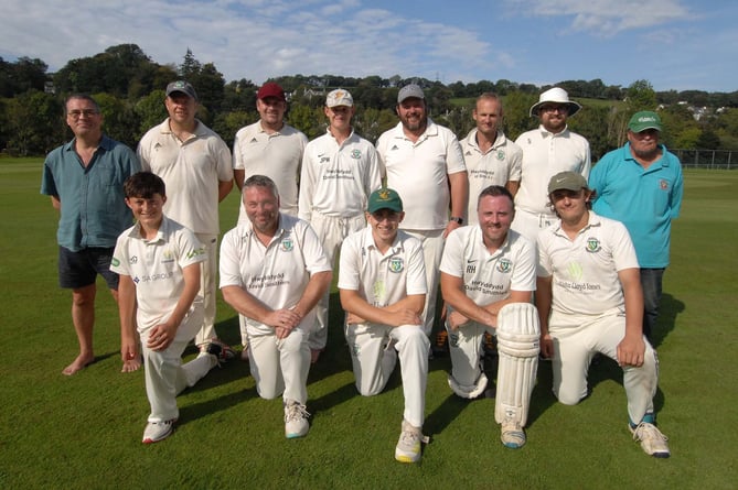 Dolgellau’s first team pictured with umpire and scorer