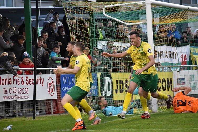 Phil Mooney celebrates his late winner for the Canaries against Pontypridd