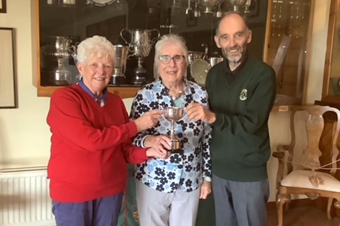 Nans Morgan (middle) presenting the Deulwyn Morgan mixed competition to the winners Ruth Morris and Owen Jenkins