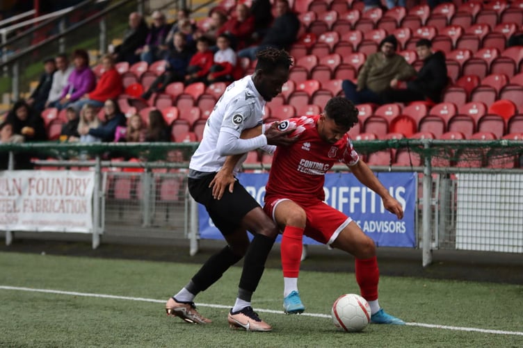 The Lakesiders' Ryan Rogers battles for possession at Latham Park 300923
