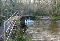 Cars left stranded in mid Wales due to flood water