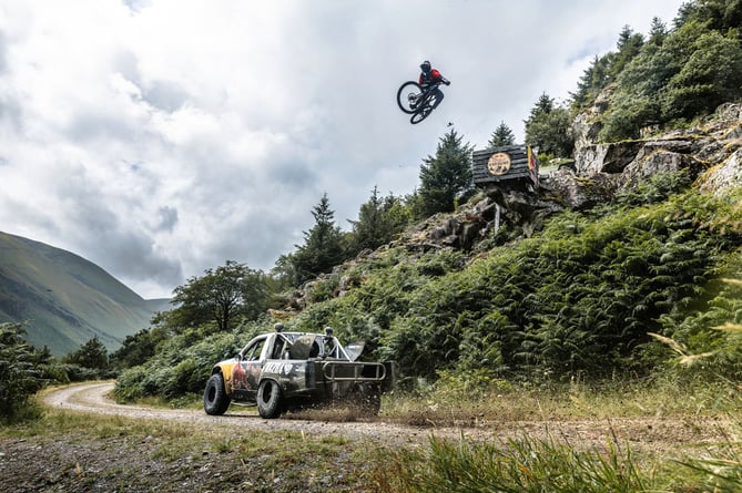 Matt Jones sat in the passenger seat with Mad Mike in his truck to try to become the fastest MTB rider ever down the Red Bull Hardline course
