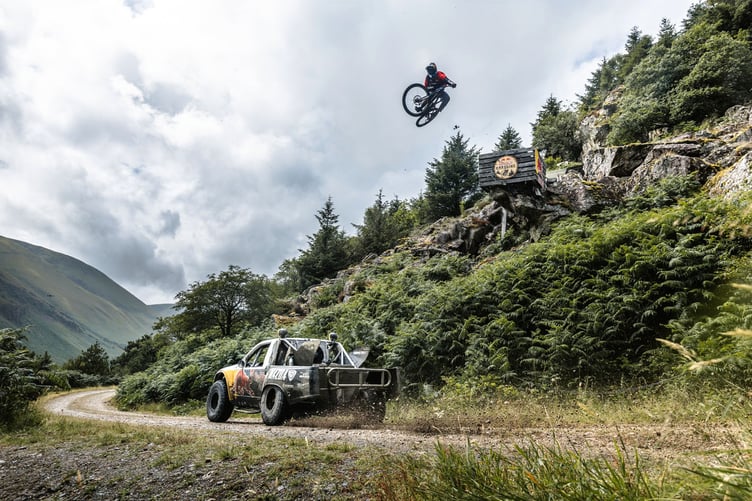 Matt Jones sat in the passenger seat with Mad Mike in his truck to try to become the fastest MTB rider ever down the Red Bull Hardline course