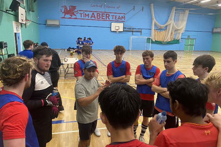 Coach Segovia instruct his players