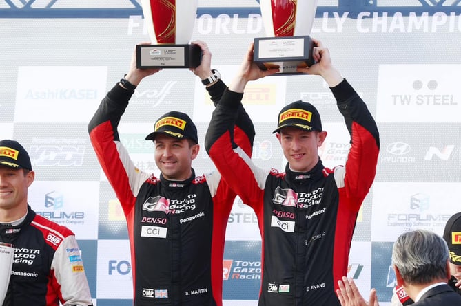 Elfyn Evans and co-driver on the podium in Japan