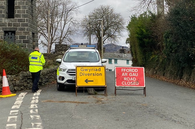 Police have closed a road near the village of Garreg