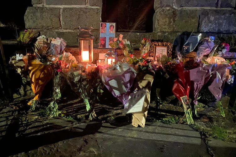Flowers, candles and pictures have been placed at a memorial to four teens who died earlier this week