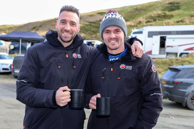 Osian Pryce (left) and co-driver for the RAC Rally, Rhodri Evans enjoy a cuppa in service 