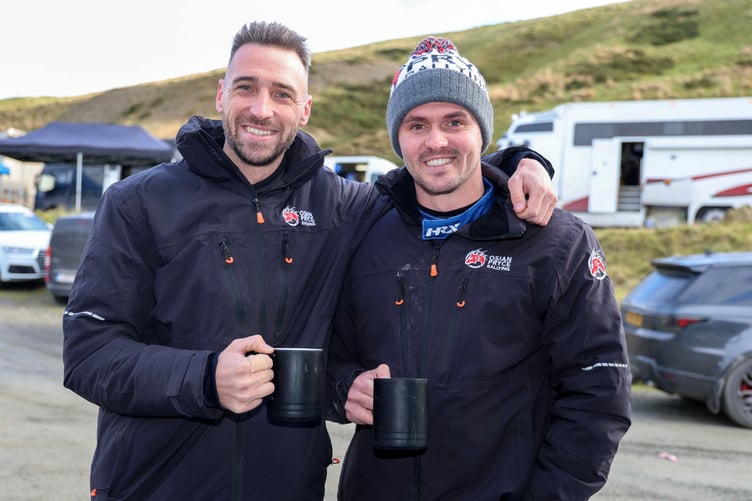 Osian Pryce (left) and co-driver for the RAC Rally, Rhodri Evans enjoy a cuppa in service