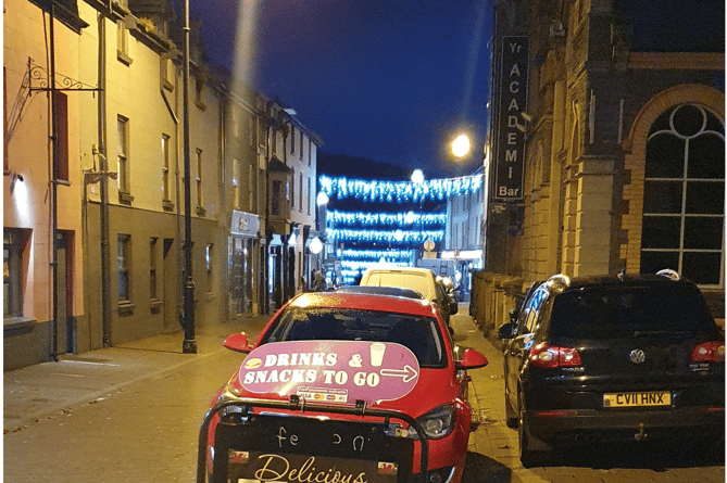 Festive lights can be seen in the distance from outside the Market Hall in Aberystwyth