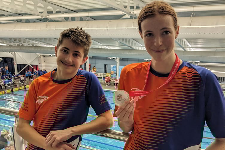 Captais Elen Morgan with her gold medal in the 50m back with male captain Ivan Rukov at Haverfordwest Leisure Centre