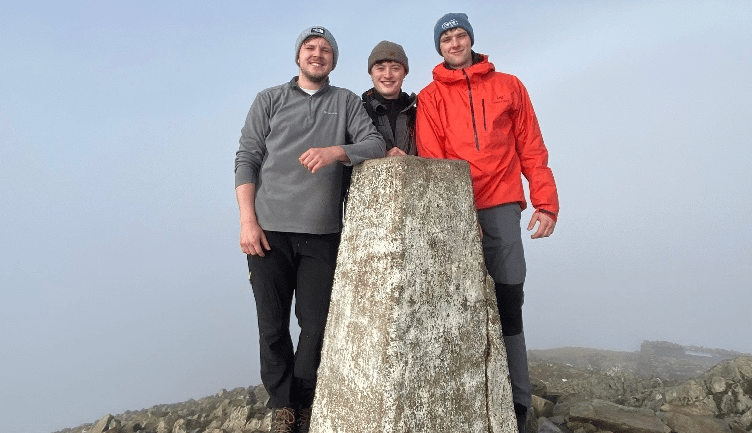 The trio on a sunny peak